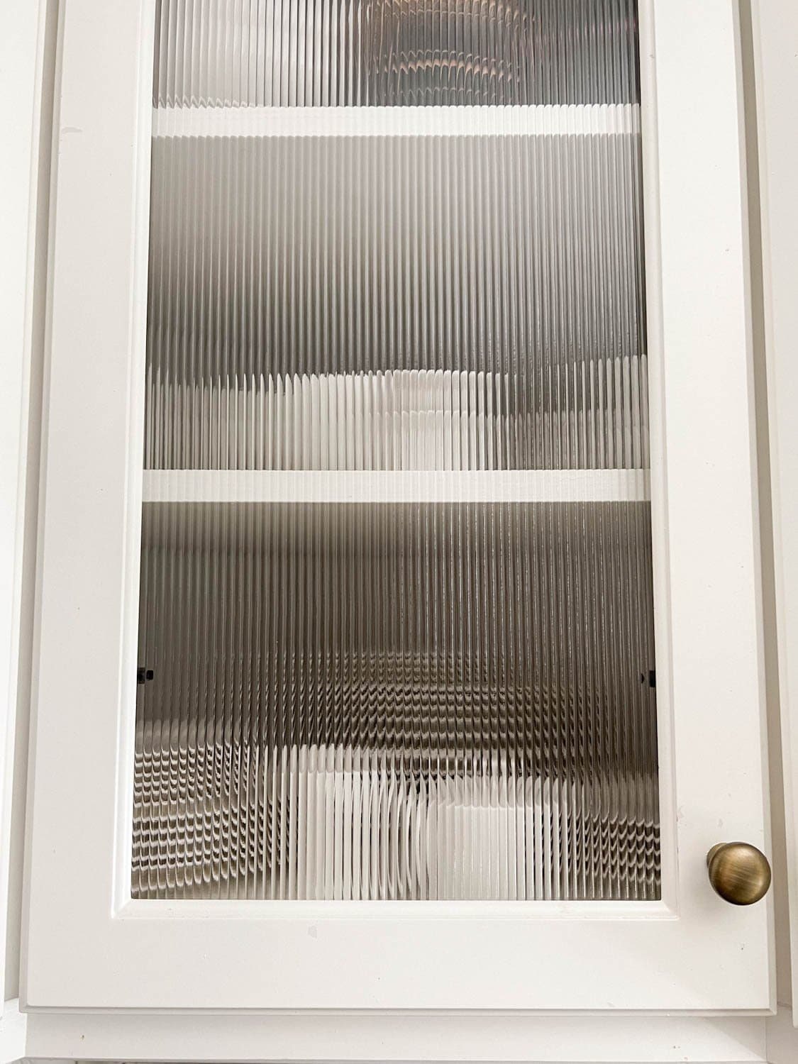 reeded glass cabinet door with antique gold kitchen cabinet knob