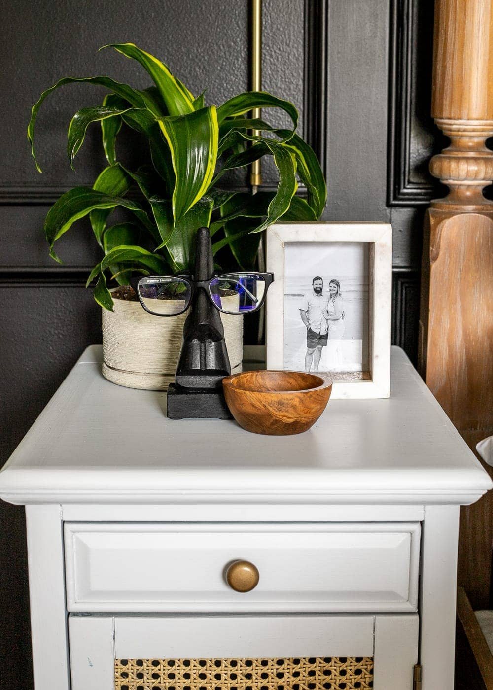 white nightstand with cane front and brushed gold knob