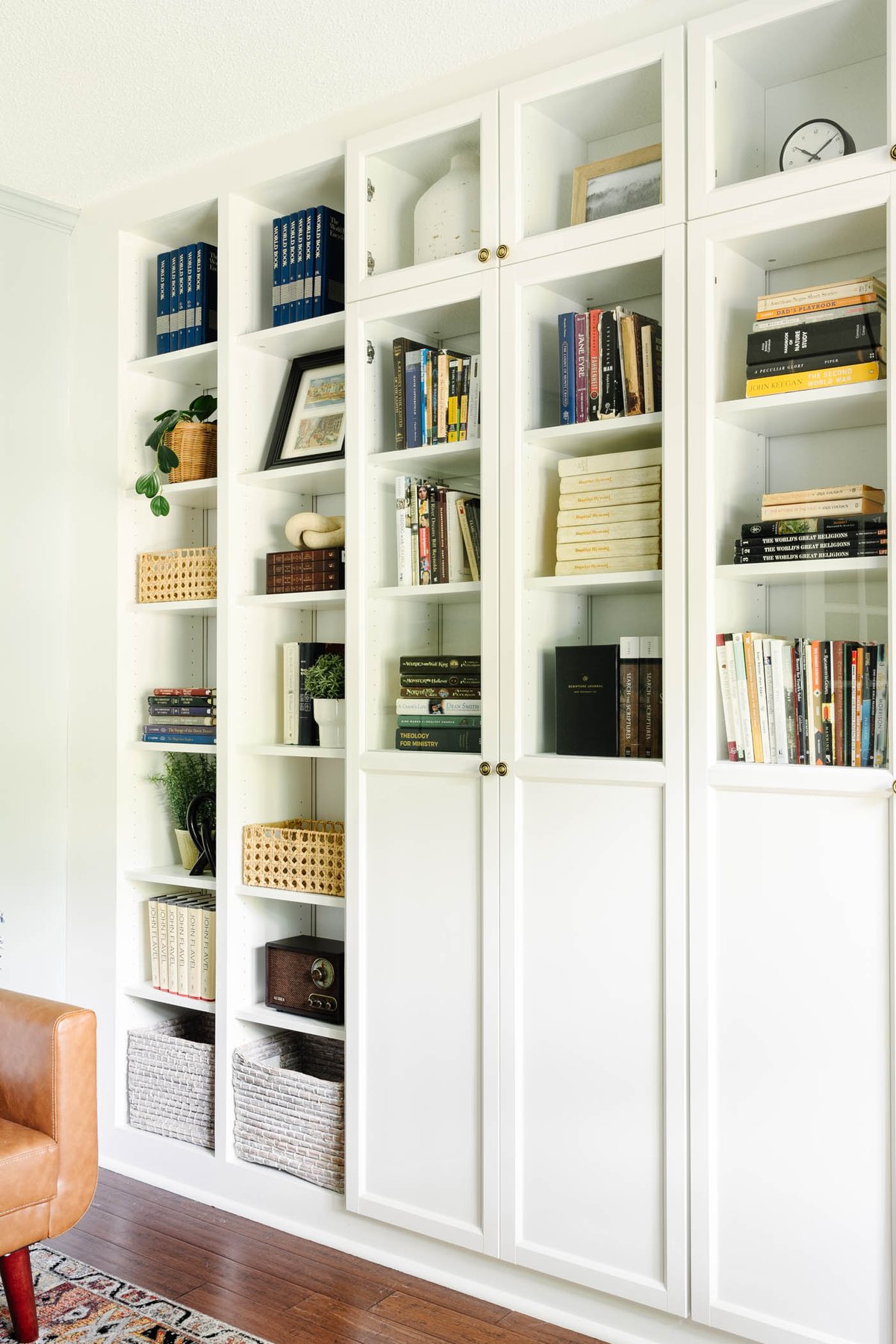 shelf decor in a home office with glass front doors