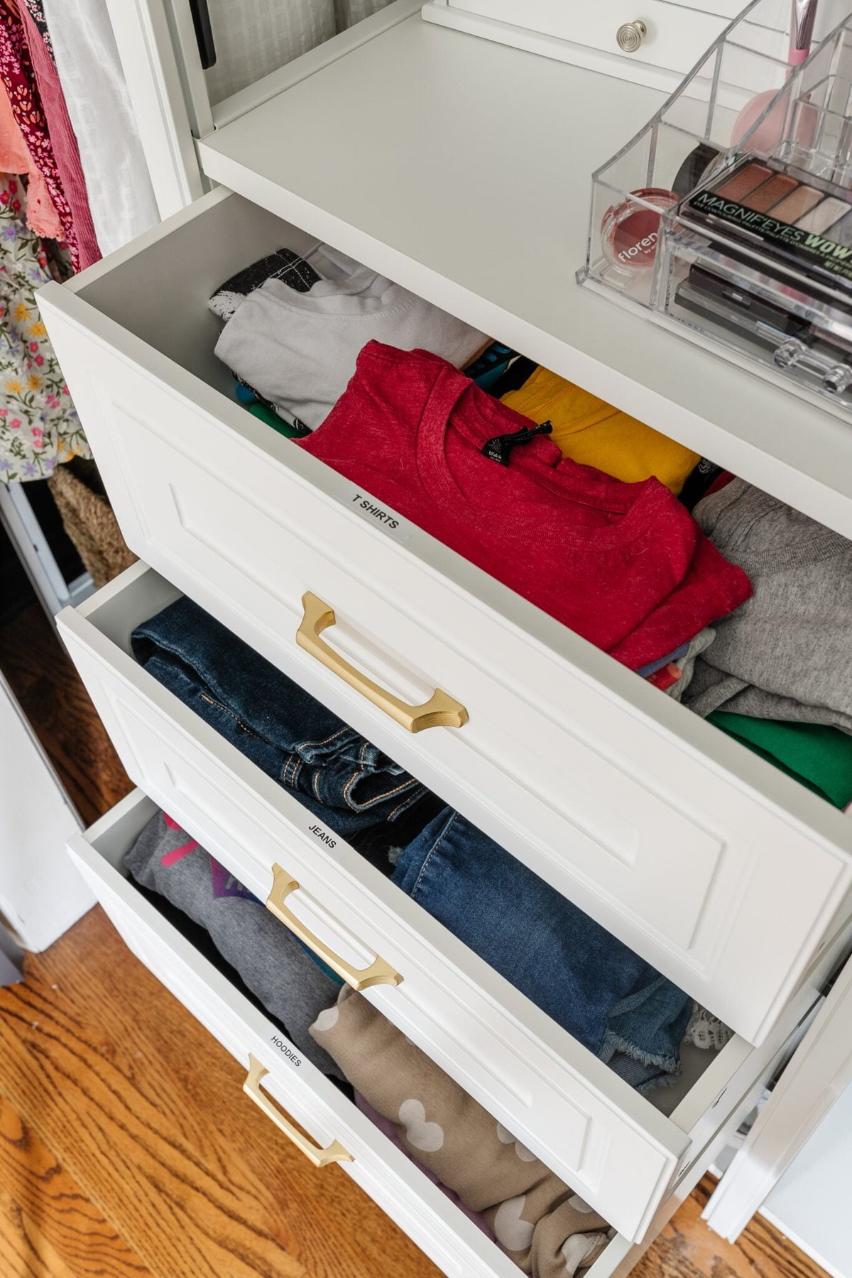 organized closet drawers with labels for clothing