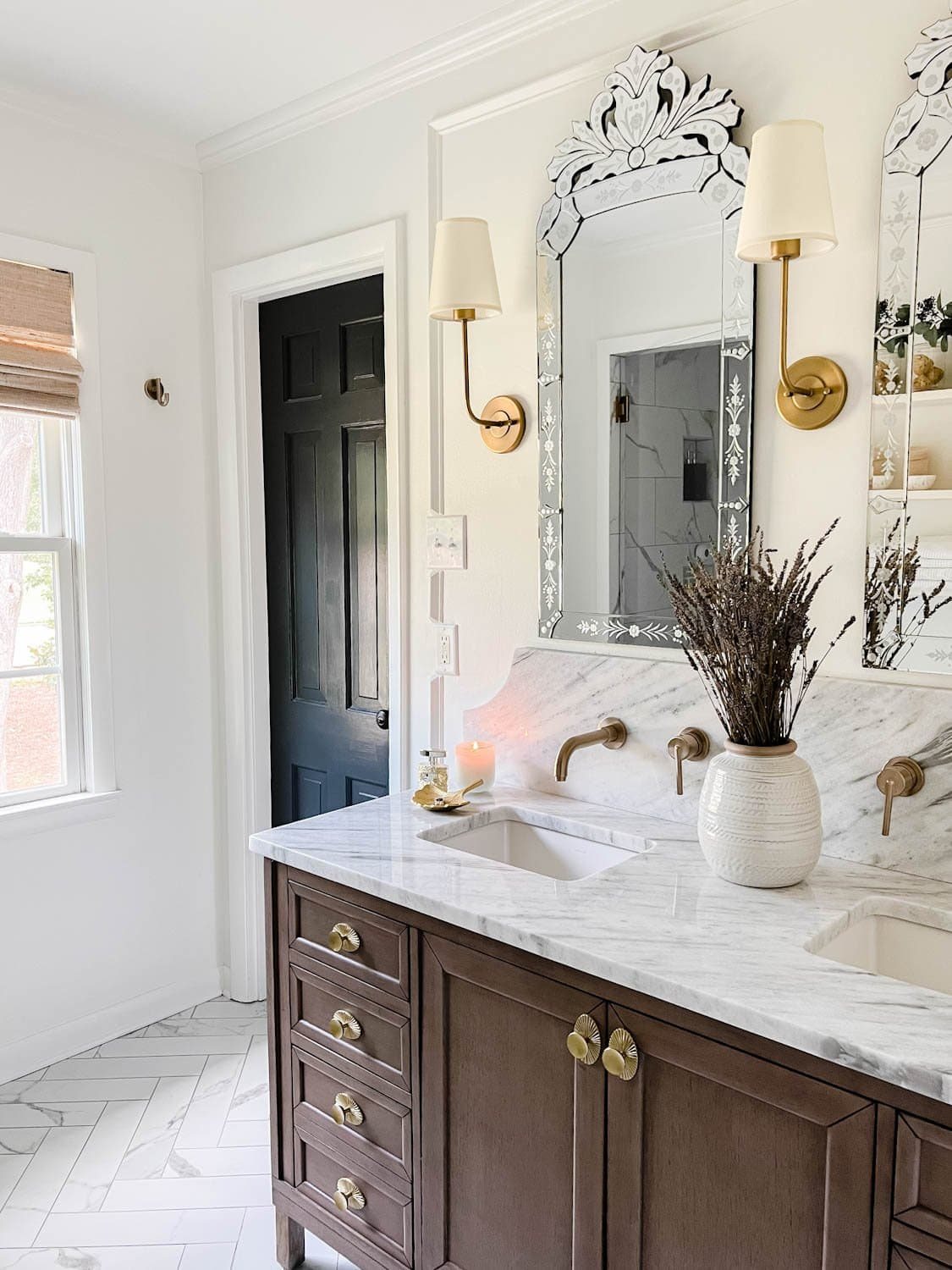 spa bathroom ideas at home with lavender, candle, shaded sconces, and decorative mirrors