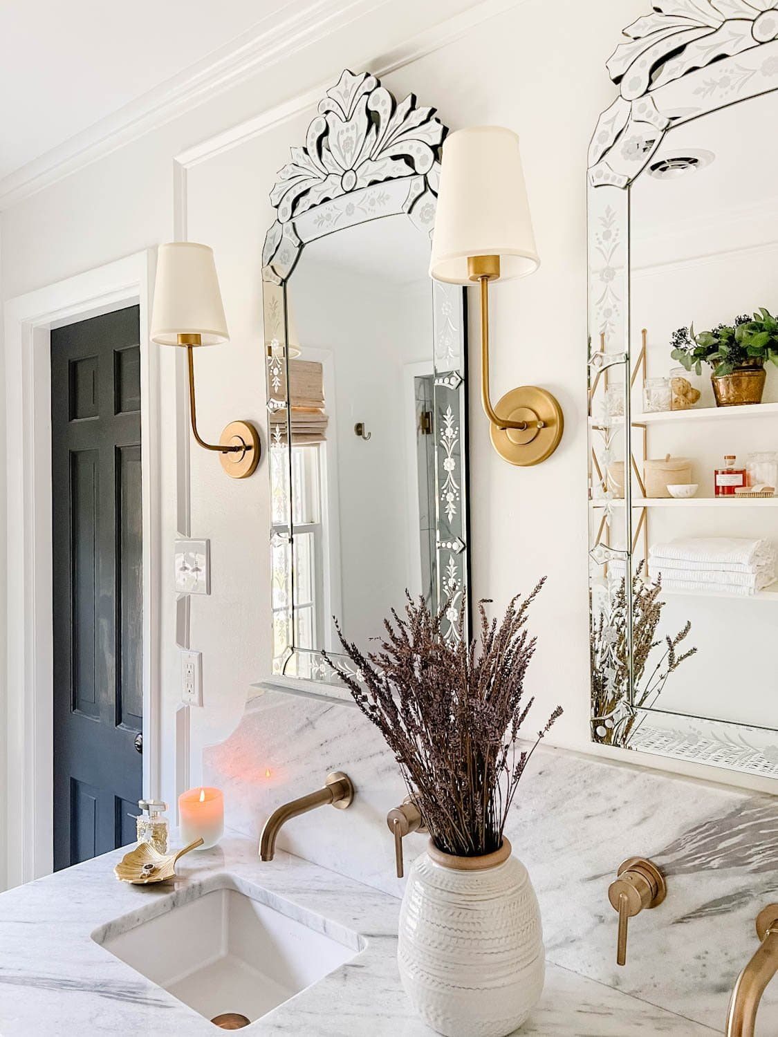 bathroom vanity decor ideas with lavender in a vase, candle, and jewelry tray