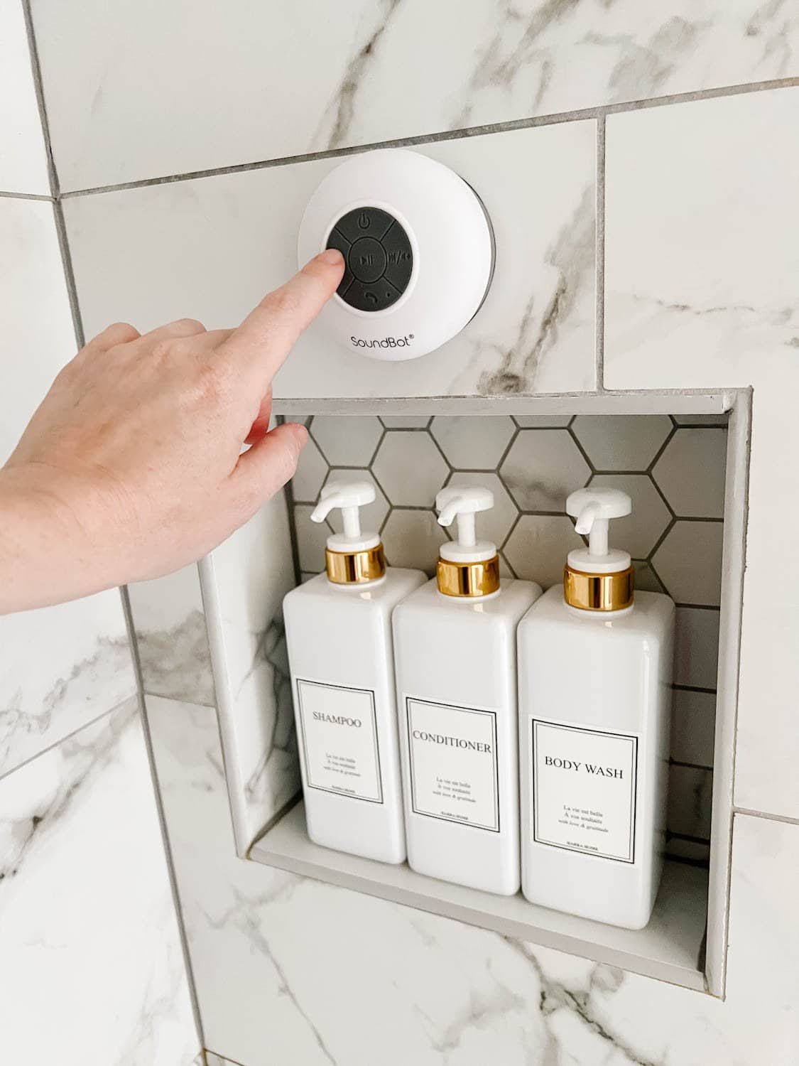 bluetooth shower speaker and matching soap dispensers to create a spa bathroom experience