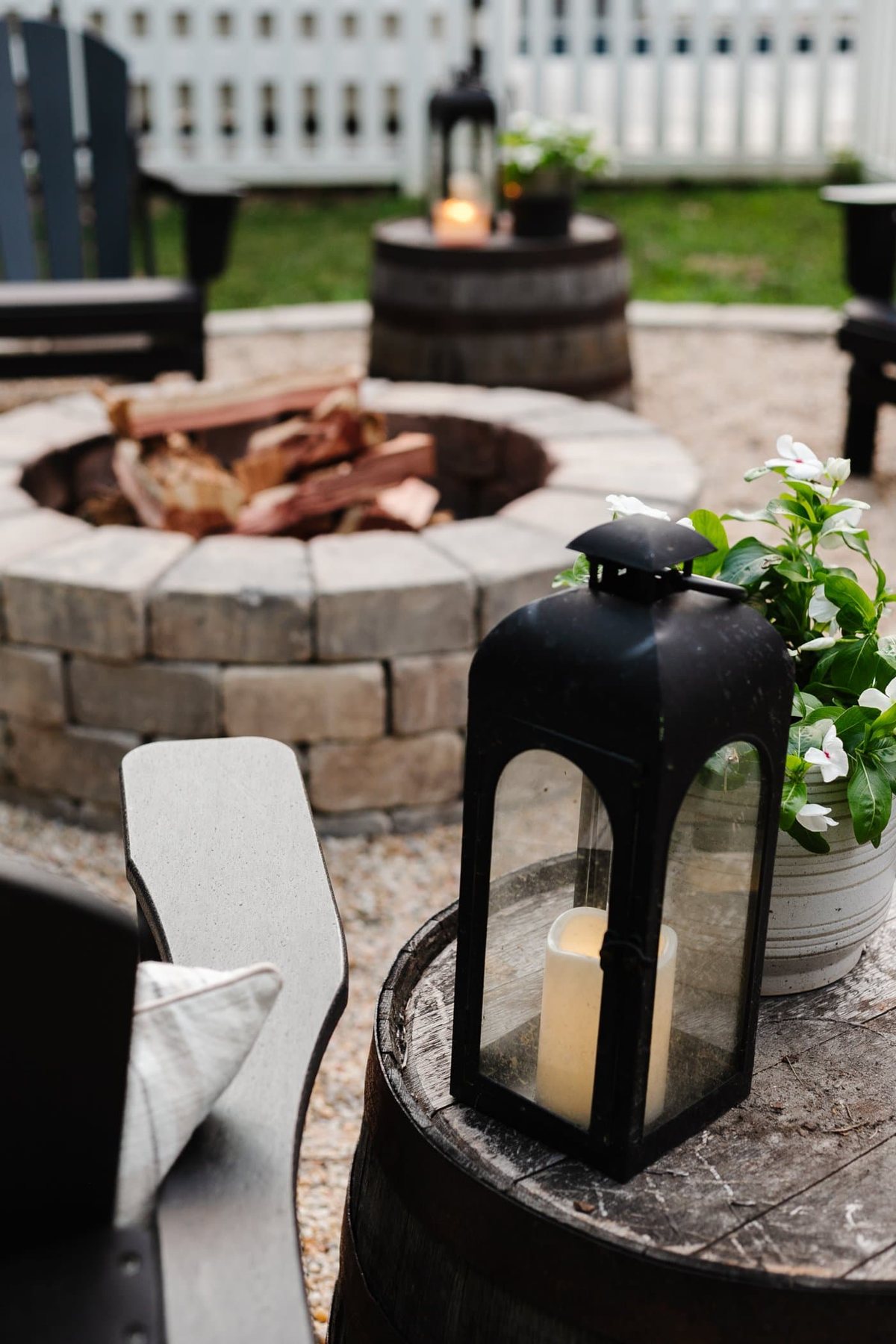 lantern beside a backyard fire pit
