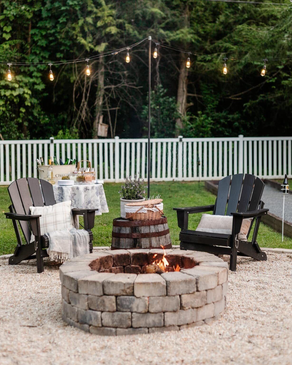 backyard fire pit party with food, drinks, and lawn games
