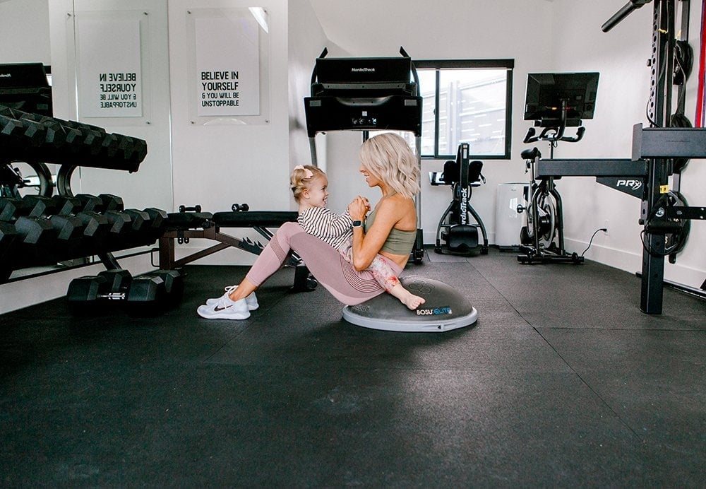 home gym with padded floor and large mirror