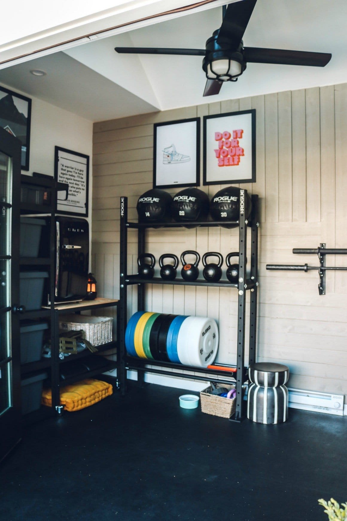 home gym with wall quotes and industrial shelving