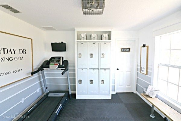home gym with repurposed lockers and treadmill