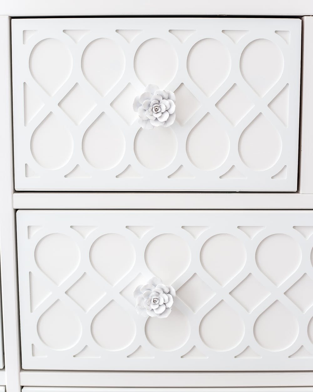 Dresser drawer details using feminine appliques and cactus flower knobs