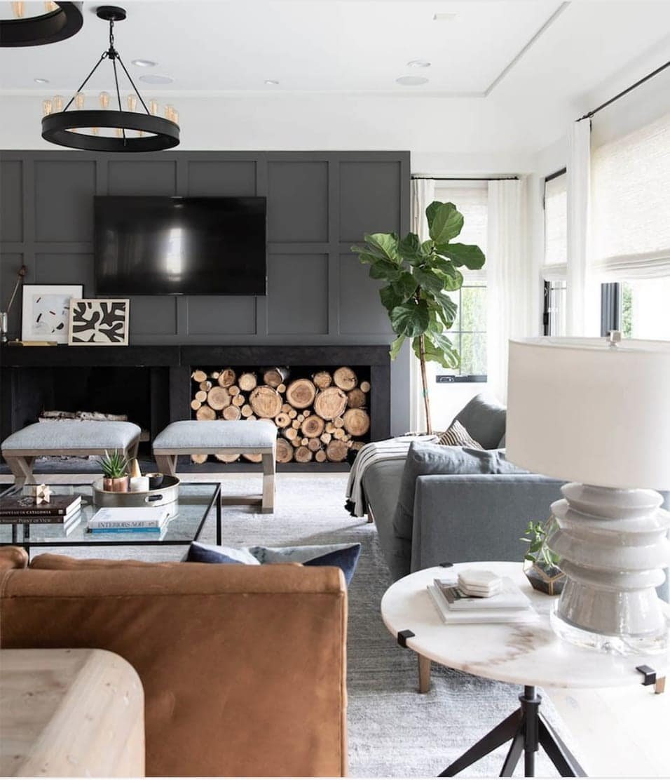 Paint the wall behind your TV dark to disguise it.