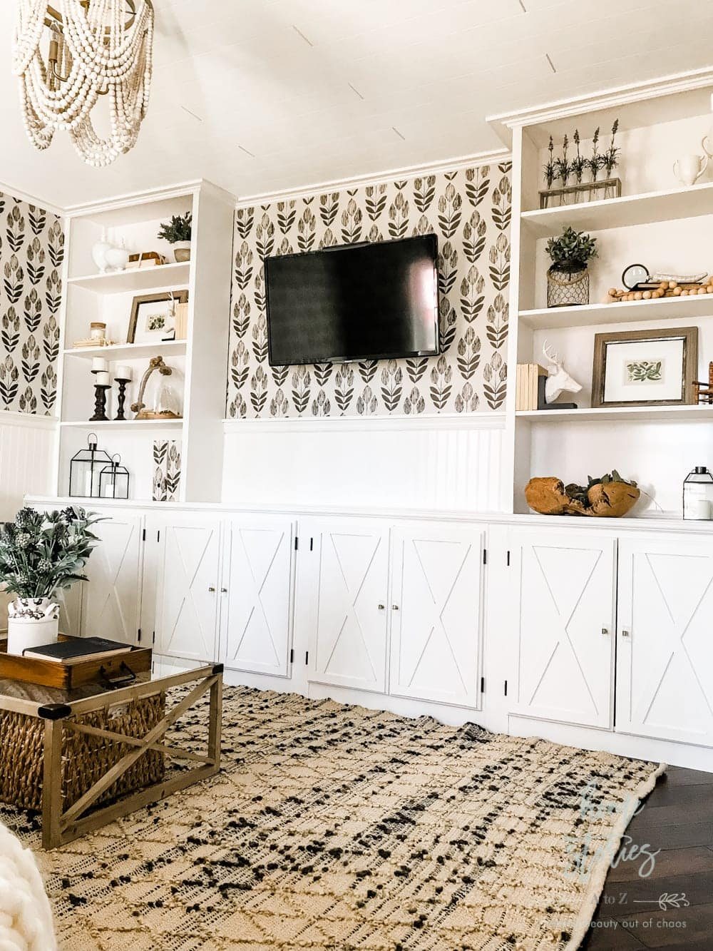 Put up pretty wallpaper behind a TV. A little pattern can go a long way and make your TV look cute in the process.