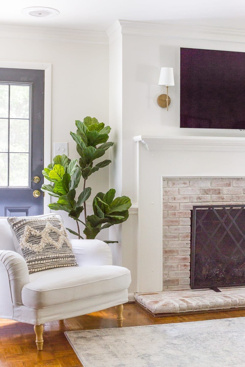 Keep your mantel simple with just a pair of sconces on either side of your TV.