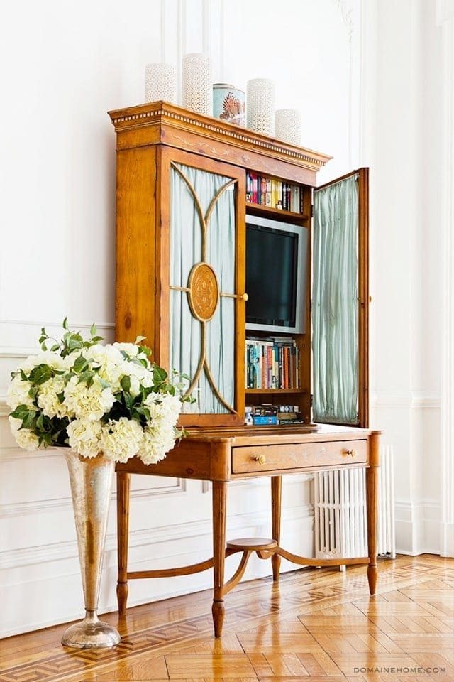 Place your TV inside of a piece of furniture.