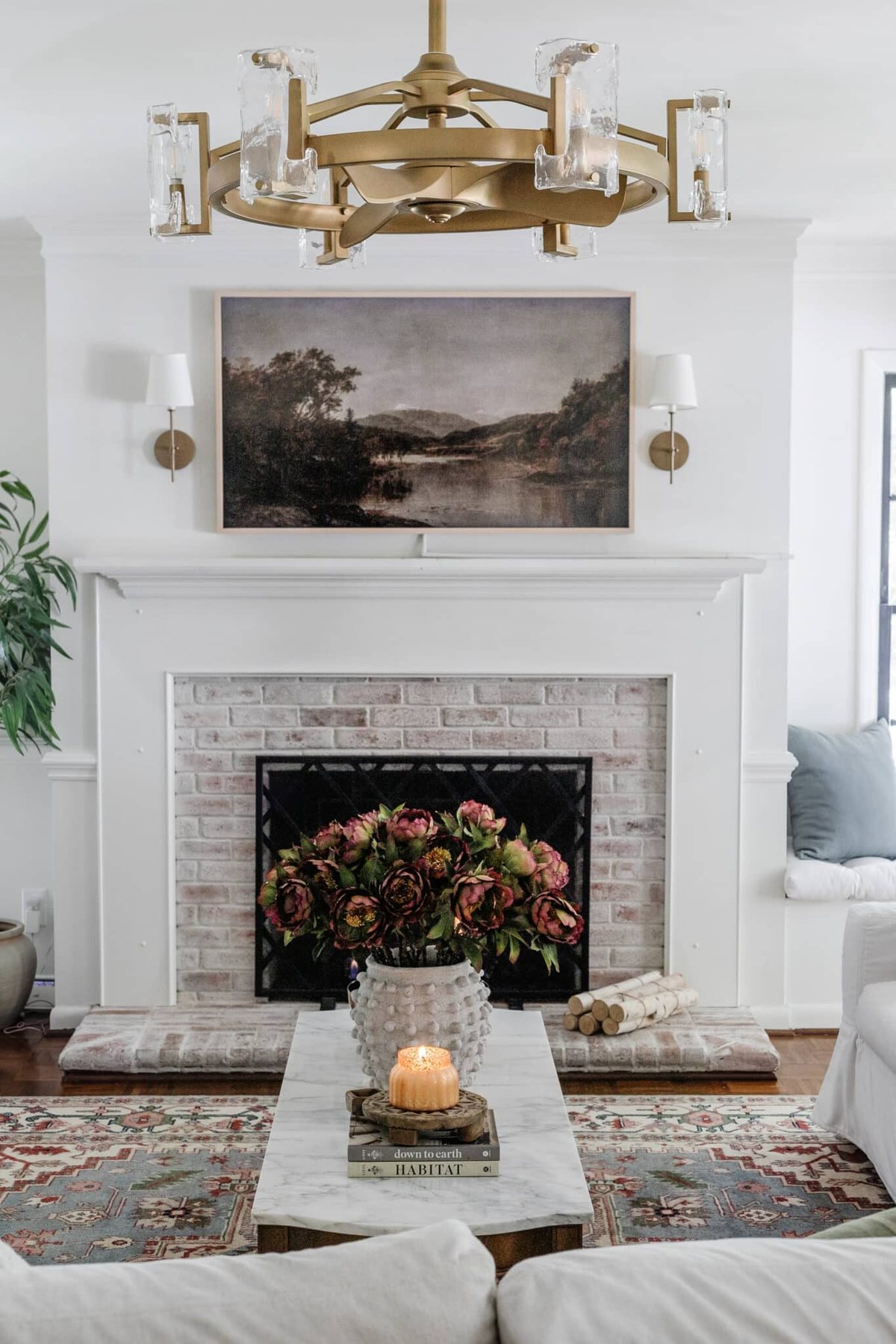 bundle of logs on a fireplace hearth for fall decor