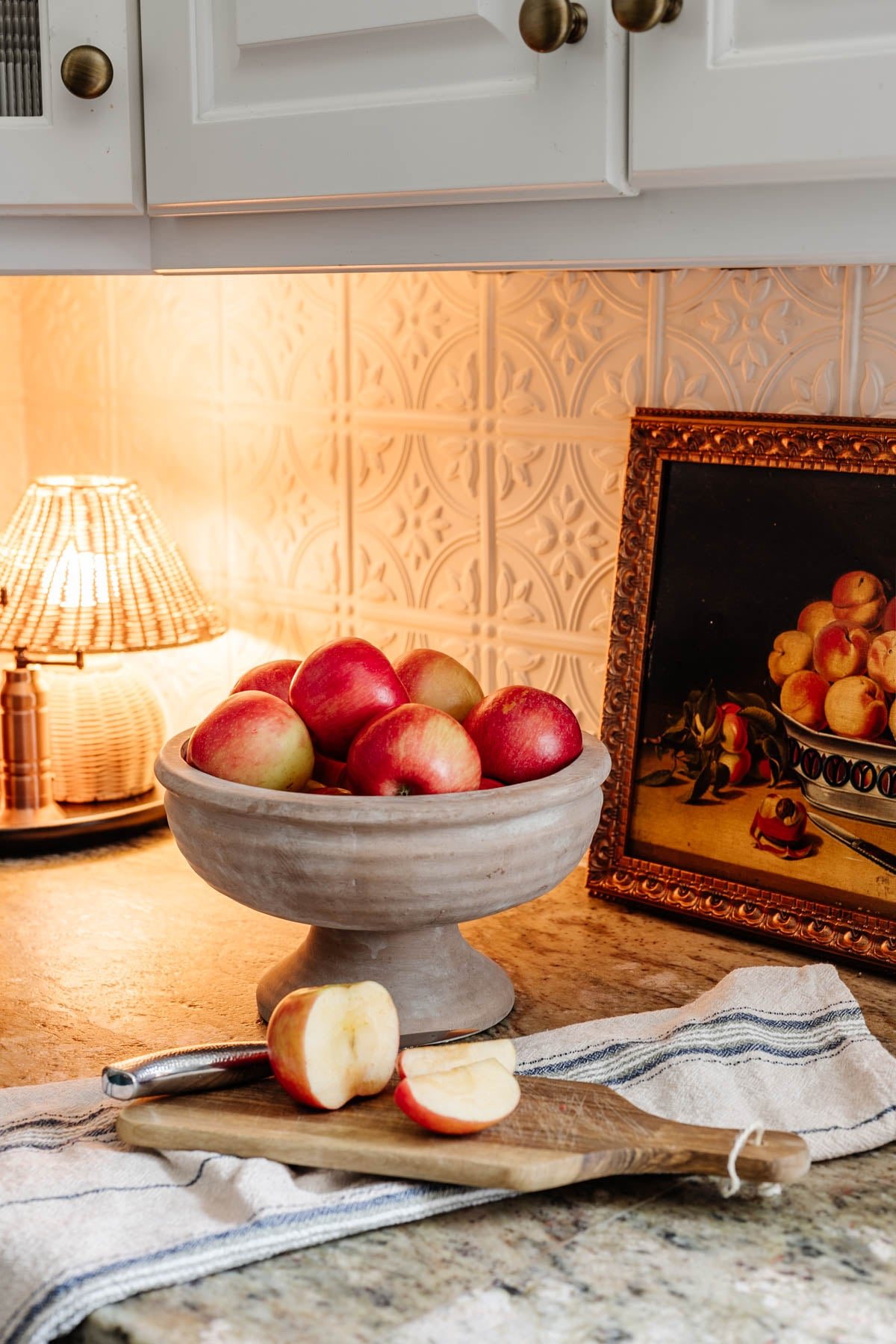 footed bowl used as fruit bowl on kitchen countertop