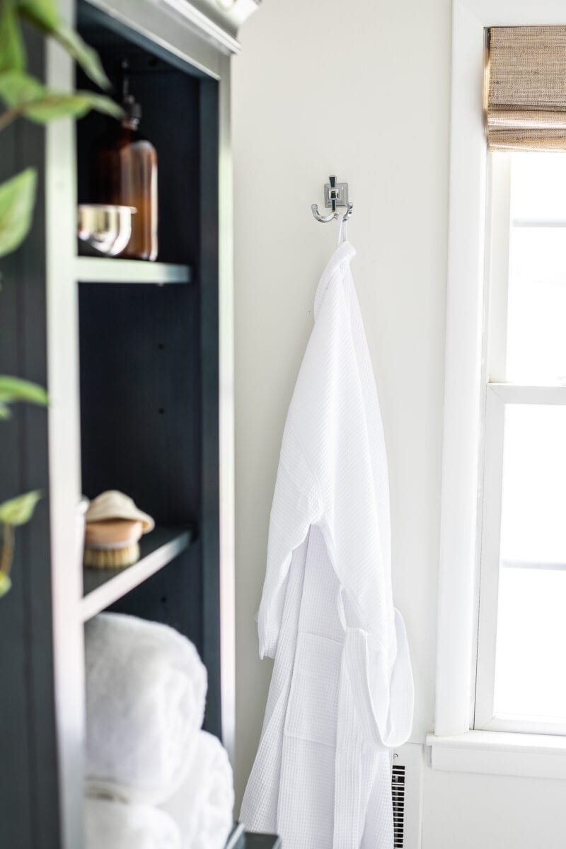 Master Bathroom Refresh | A dated master bathroom gets a quick and inexpensive modern refresh using paint, wallpaper, sheet vinyl, and hardware.