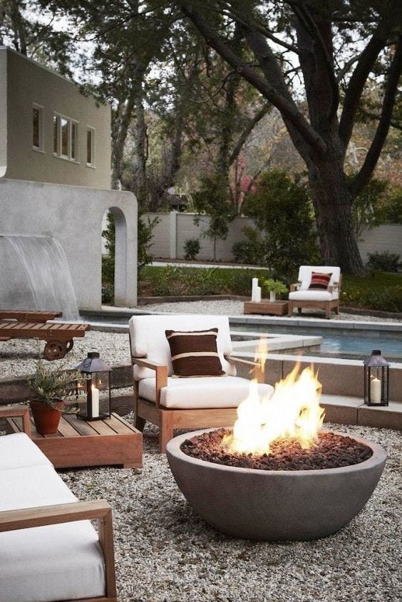 backyard fire pit with pea gravel