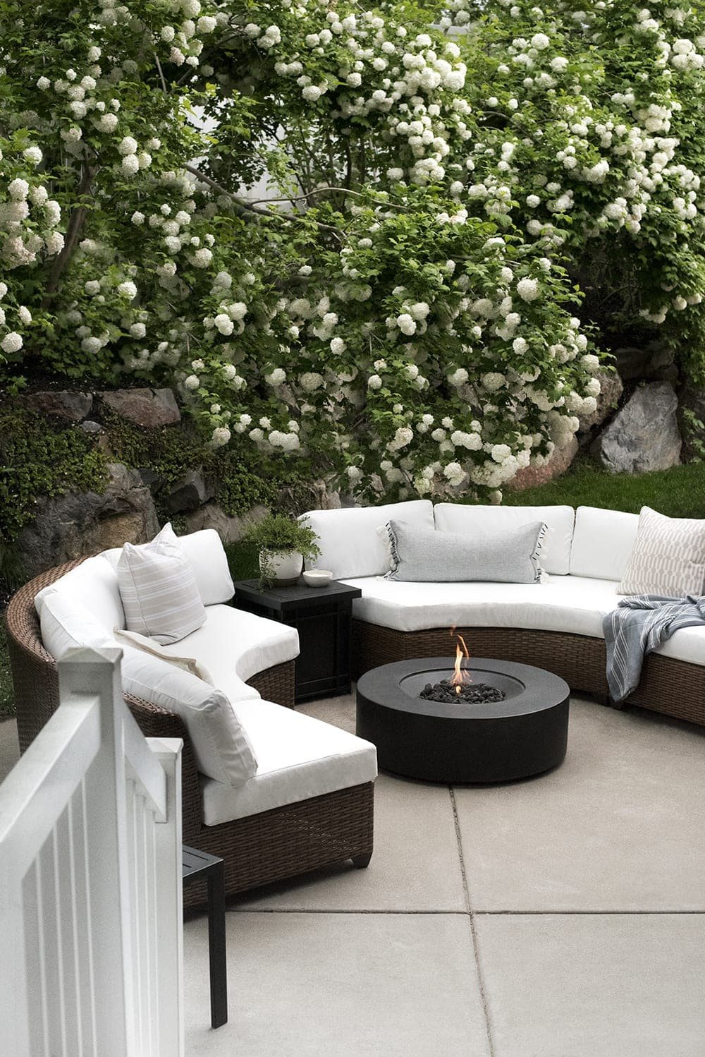 back patio fire pit with curved sectionals