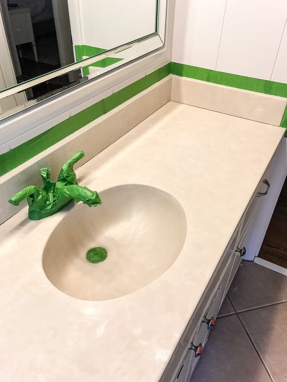 how to paint countertop - tape all edges and fixtures