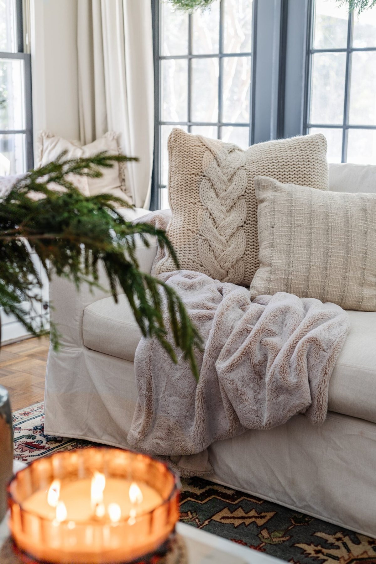 neutral winter pillows for Christmas on couch
