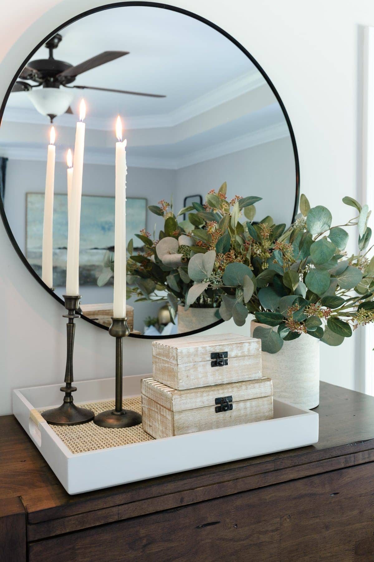 thrift store home decor featuring candle holders and decorative boxes