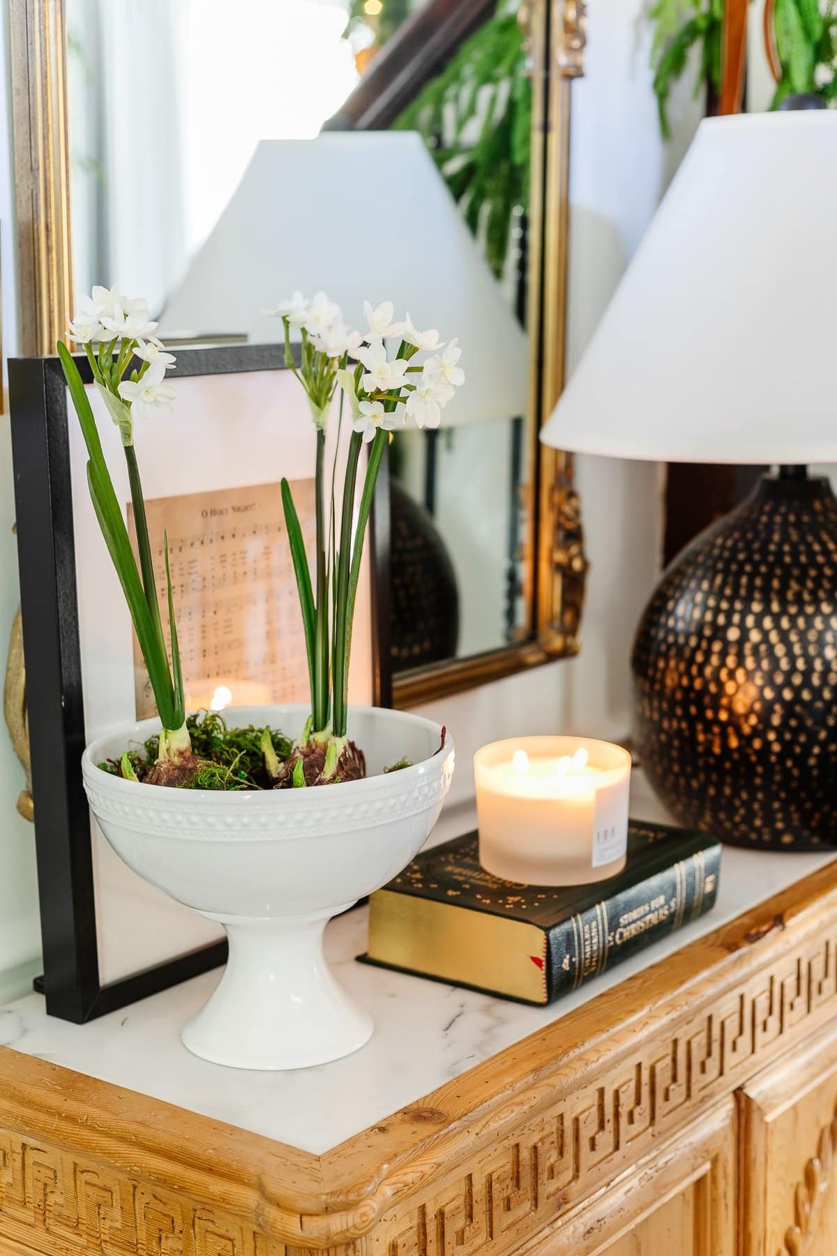 bowl of paperwhite flowers on entryway table