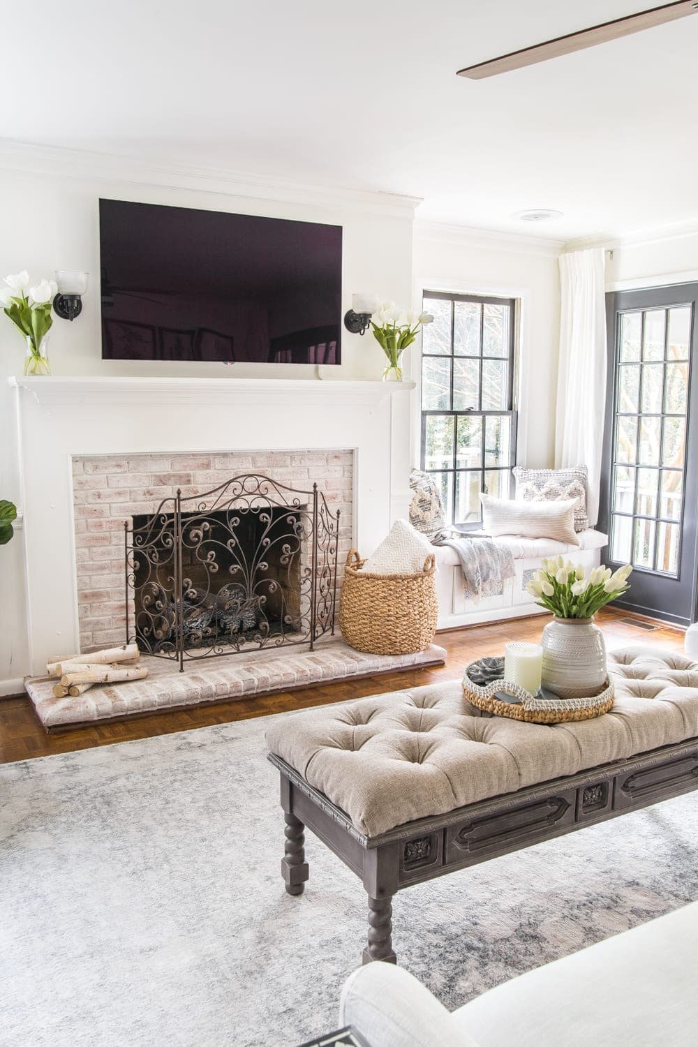 Simple Spring Home Tour | Neutral living room decorated with small floral touches for spring