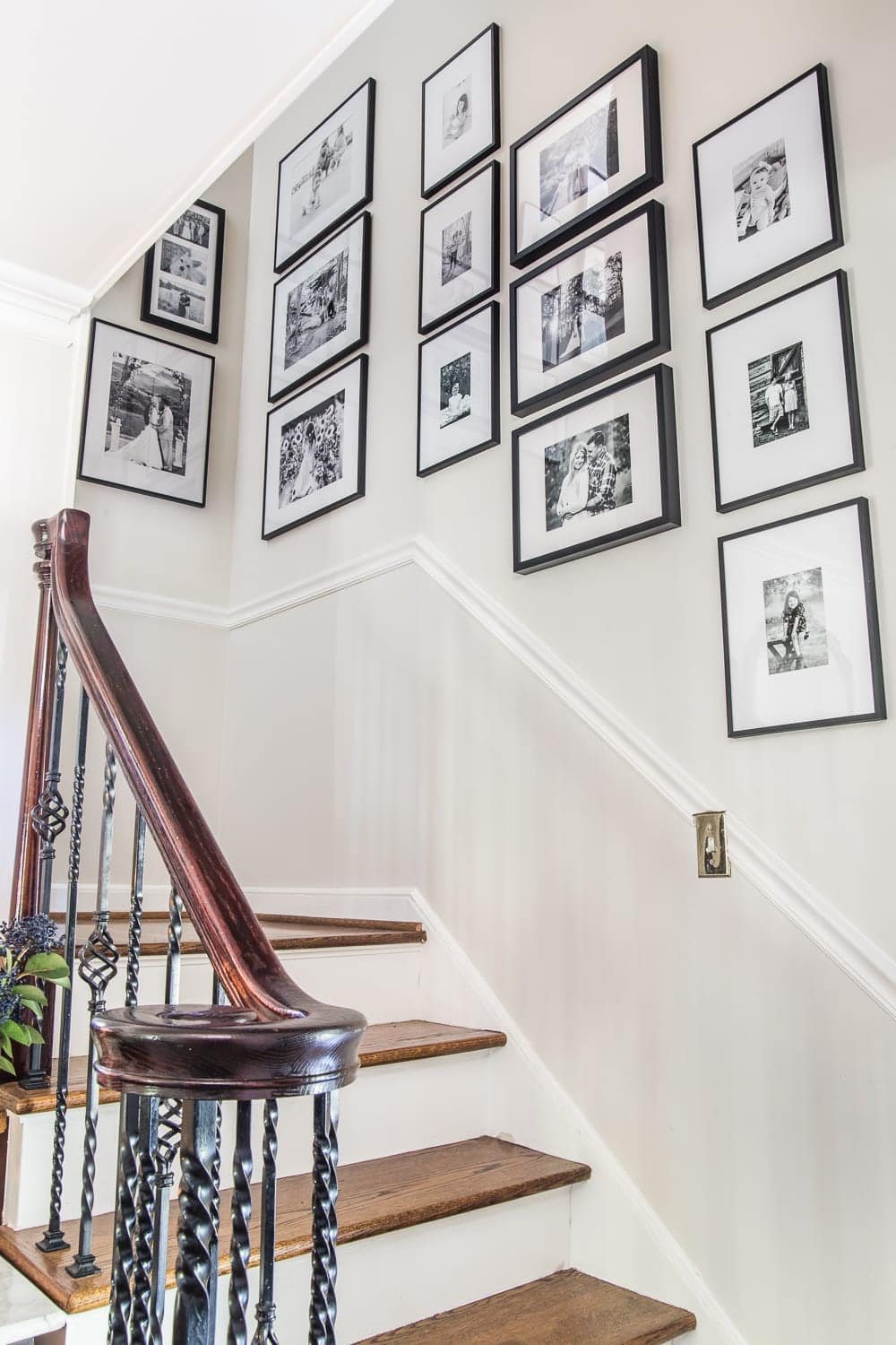 stairway gallery wall using black and white frames