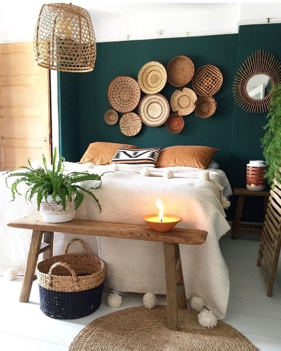 baskets hanging on a bedroom wall above a bed