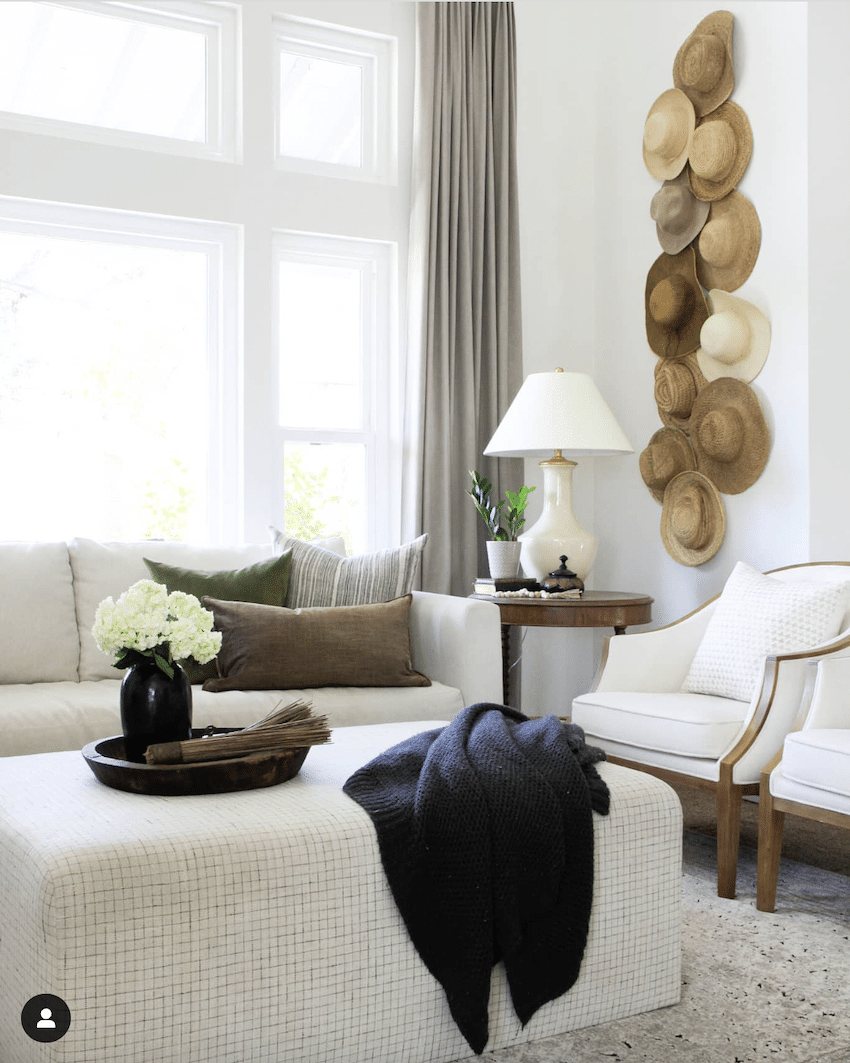 hats hanging on a wall for diy wall decor in a living room