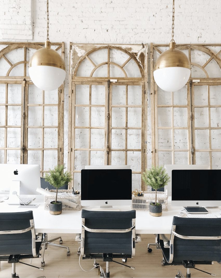 windows leaning on a brick wall for office wall decor