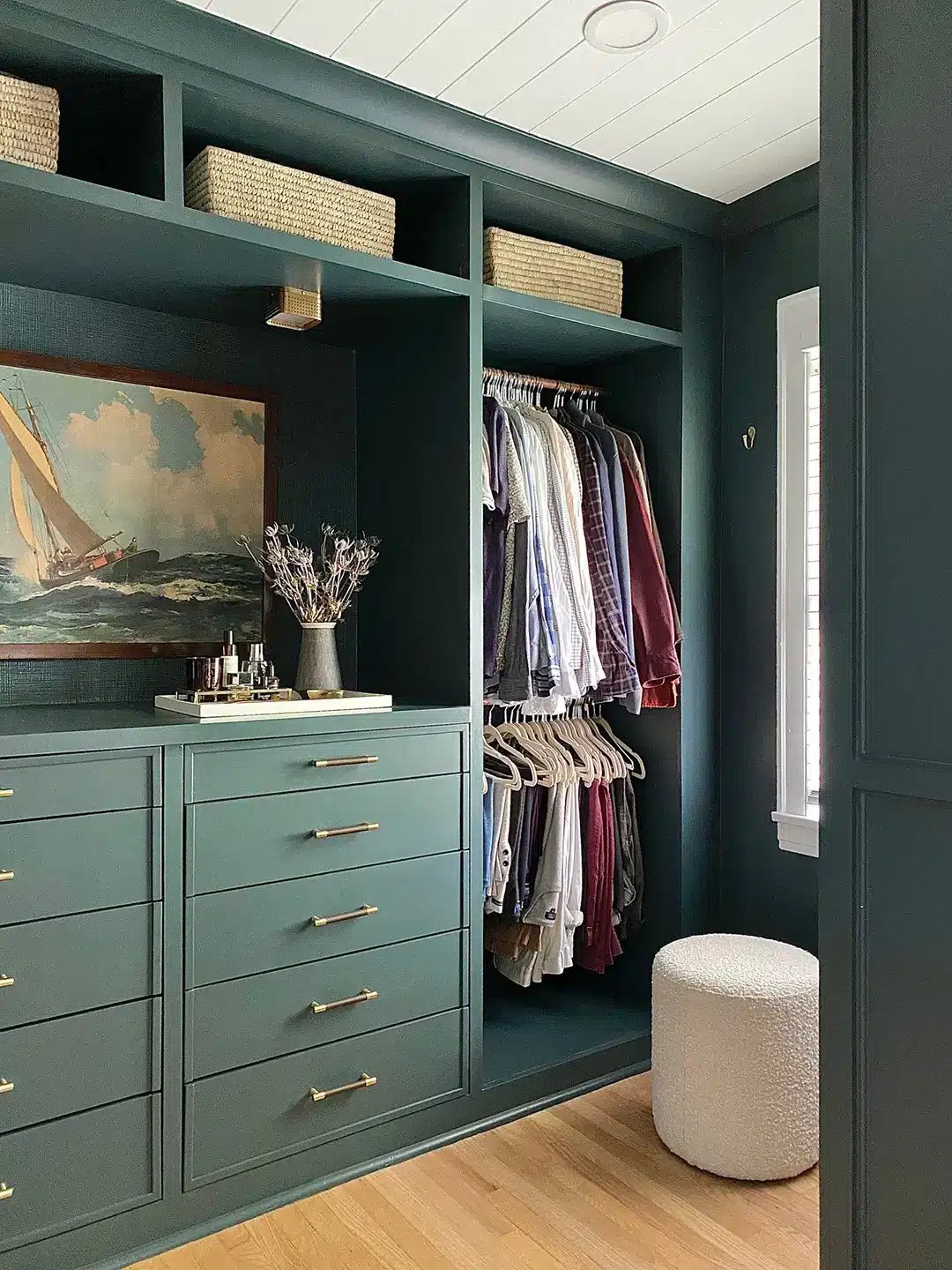 built in drawers in a closet painted green