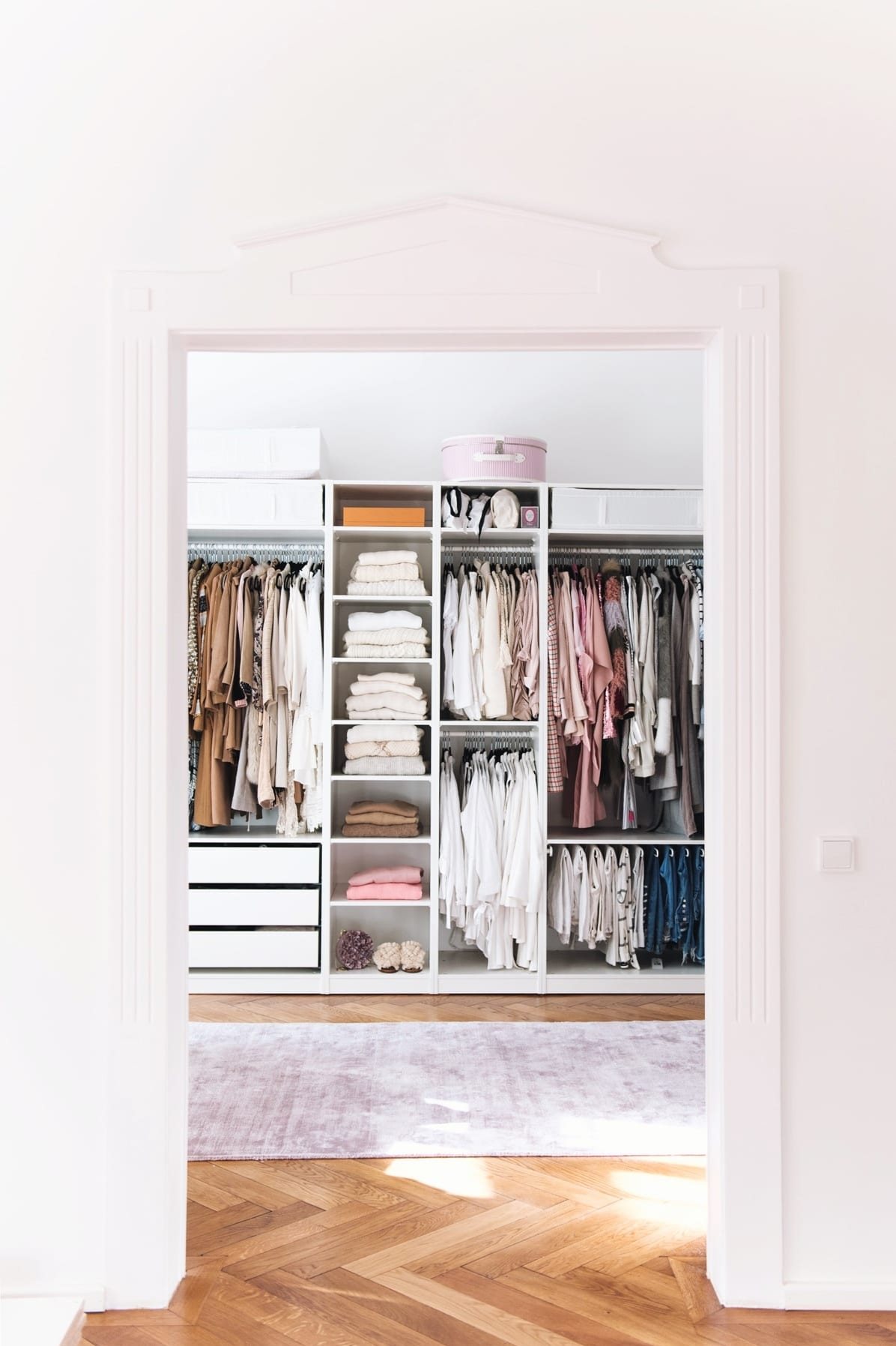 IKEA PAX Closet with herringbone wood floors and encasement