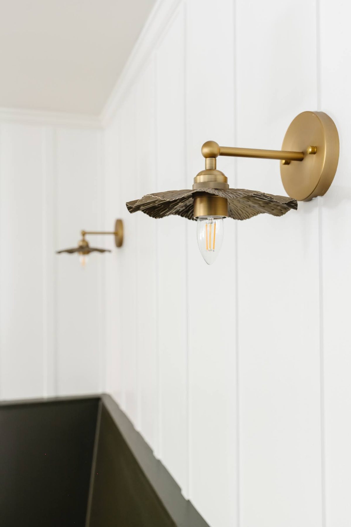 flower vintage wall sconces on a white board and batten wall