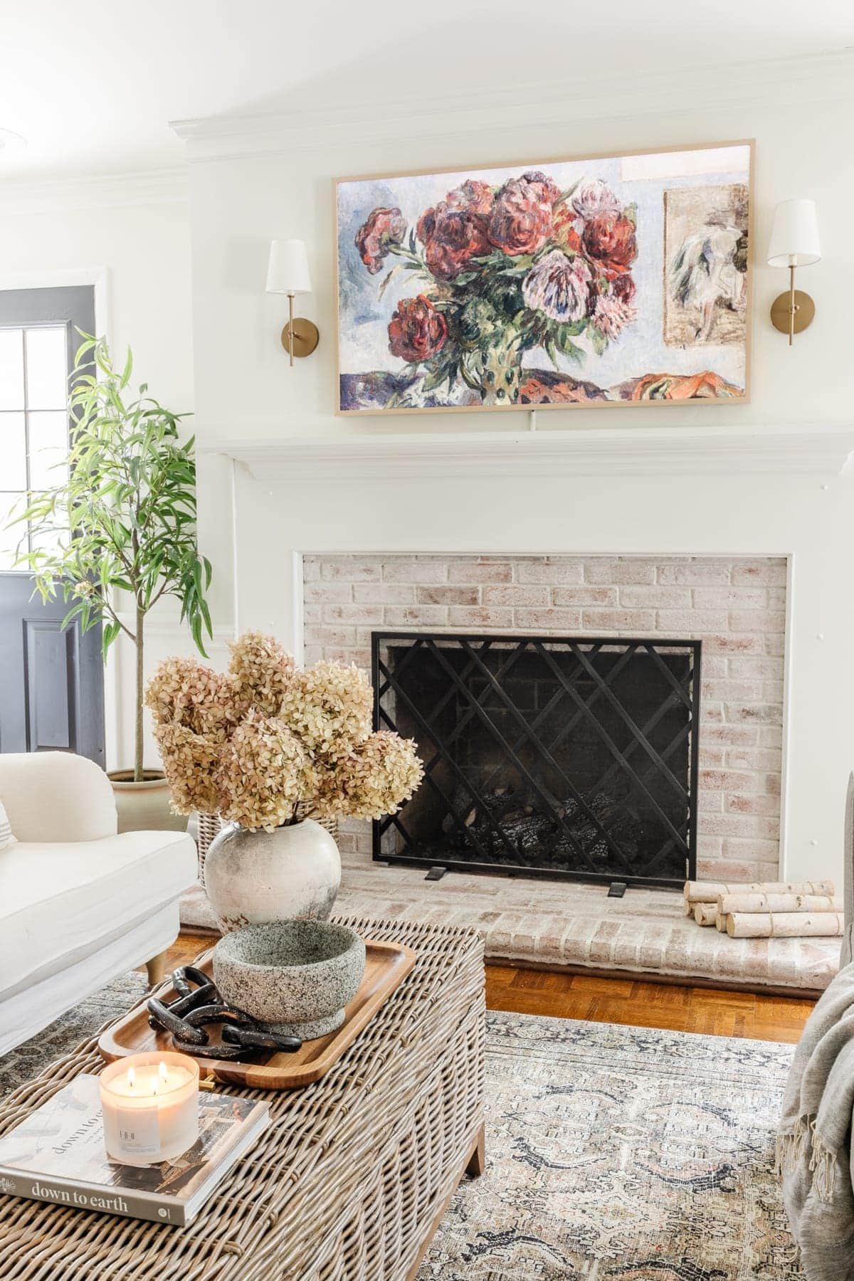 all white neutral living room and frame TV art