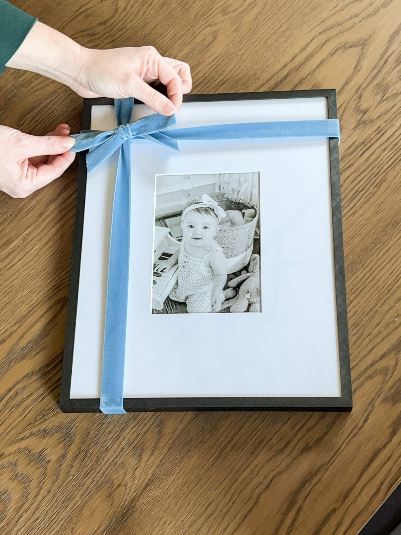 Christmas bow tied onto a picture frame