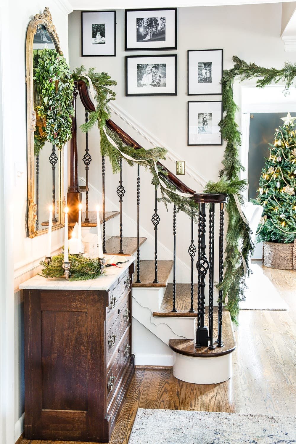 Classic Christmas Foyer | unigumushane.com - A classic traditional entryway / foyer decorated for Christmas using fresh pine and holly greenery and a St. Lucia Day Advent wreath. #christmasfoyer #classicdecor #traditionalchristmas