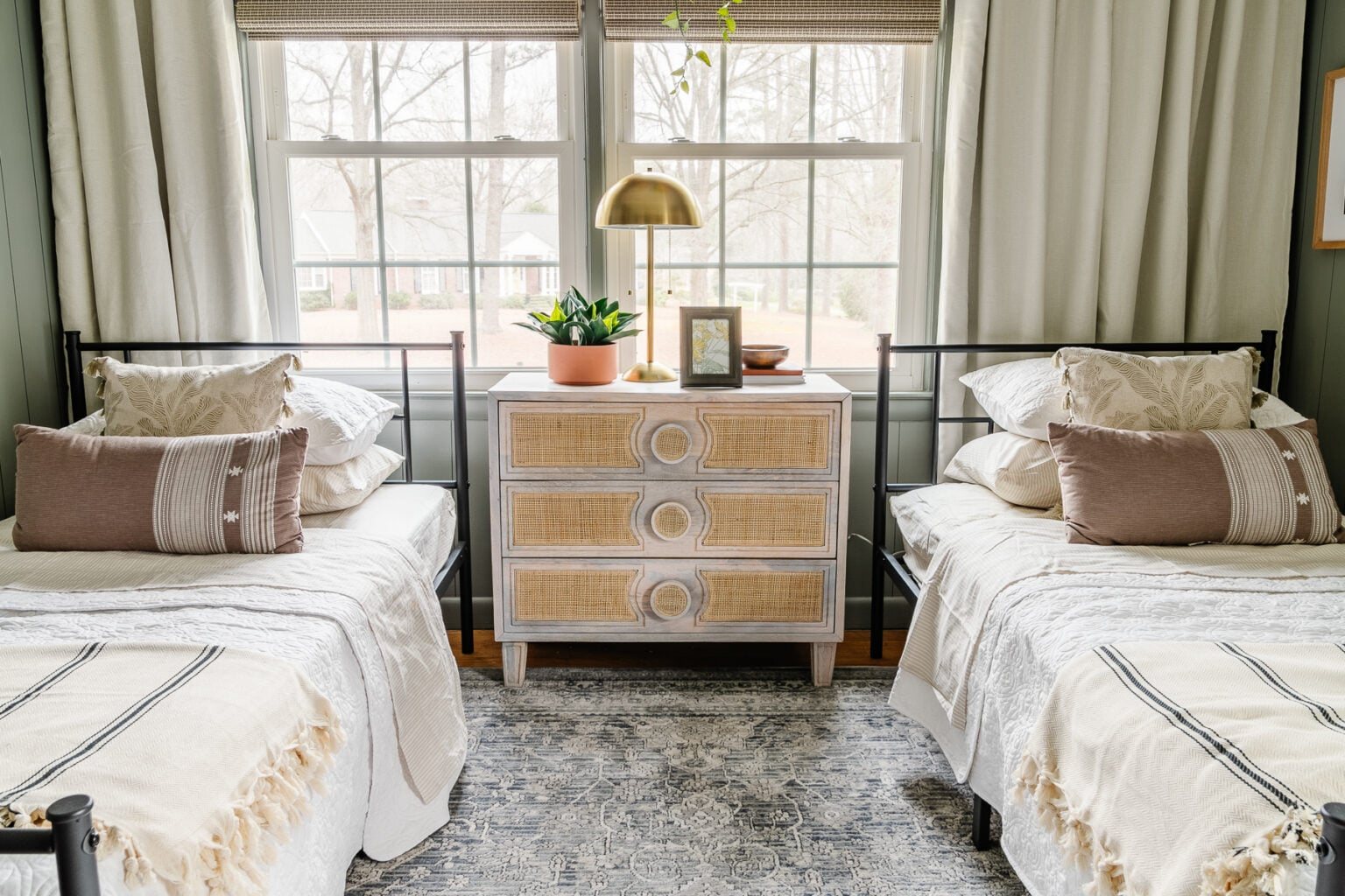 bedroom with twin beds in front of off center window