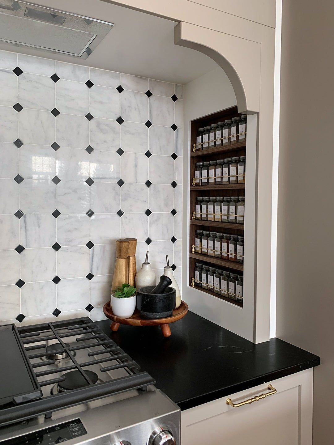 recessed spice rack between studs as kitchen storage