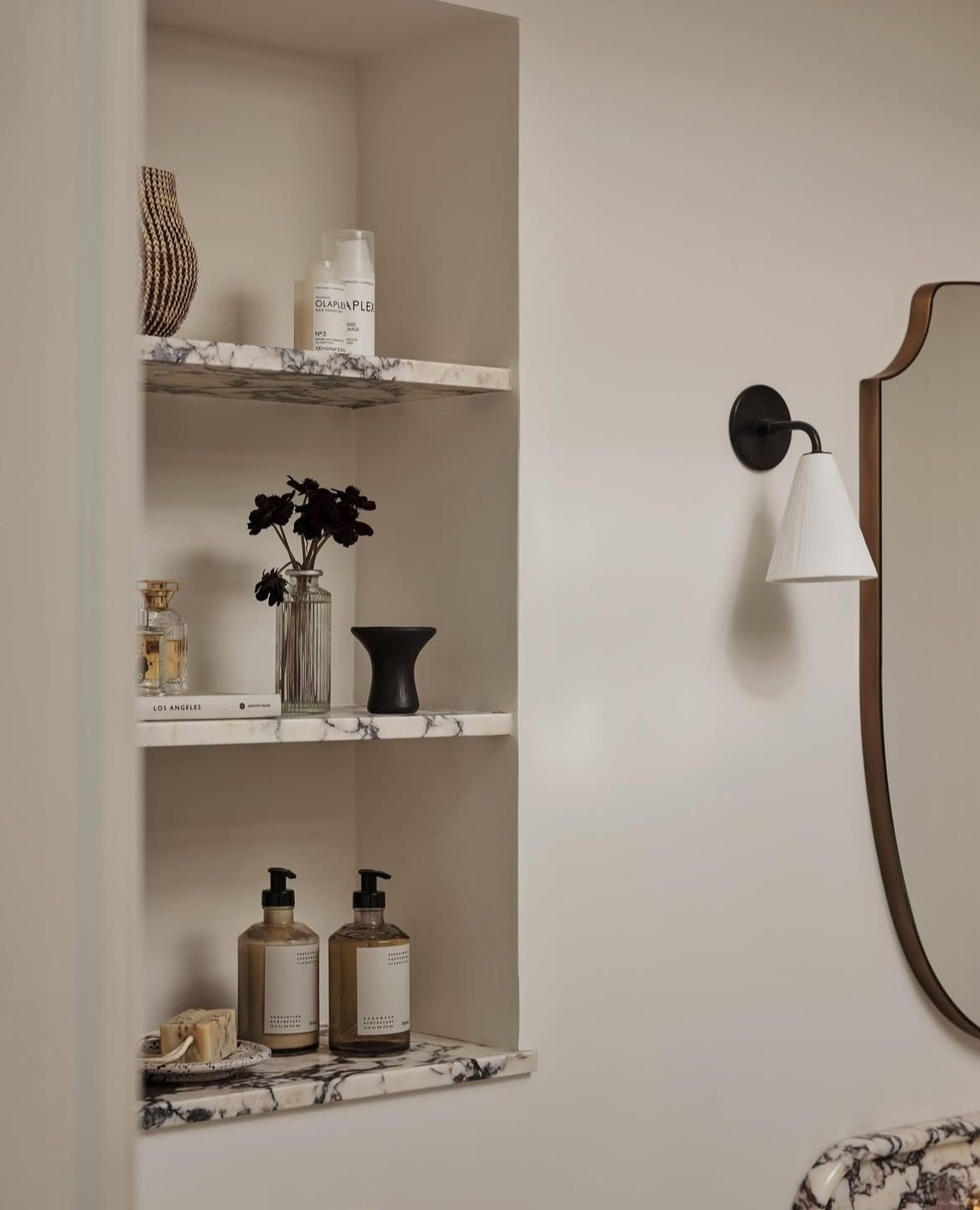 Recessed bathroom shelves between studs