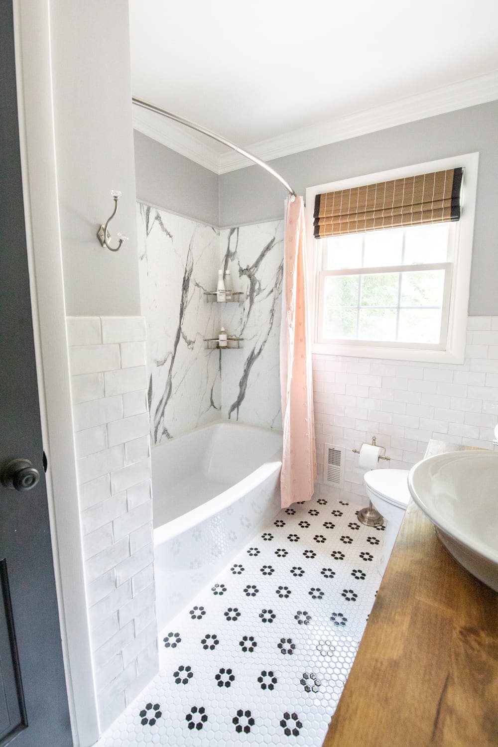 Whimsical, classic kids bathroom makeover | faux marble shower with American Standard Passage Collection and retro tile floor