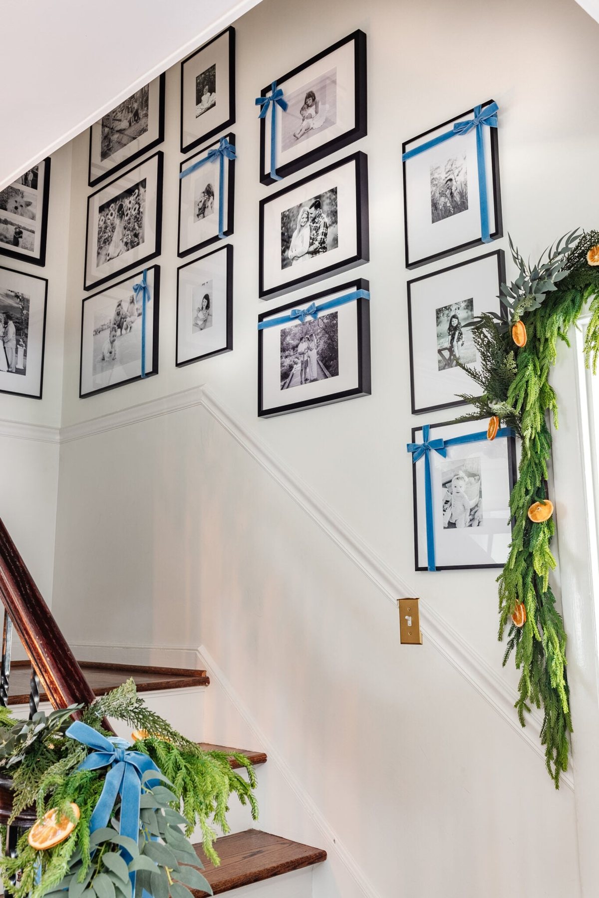 family photo gallery wall with christmas bows as easy ribbon art