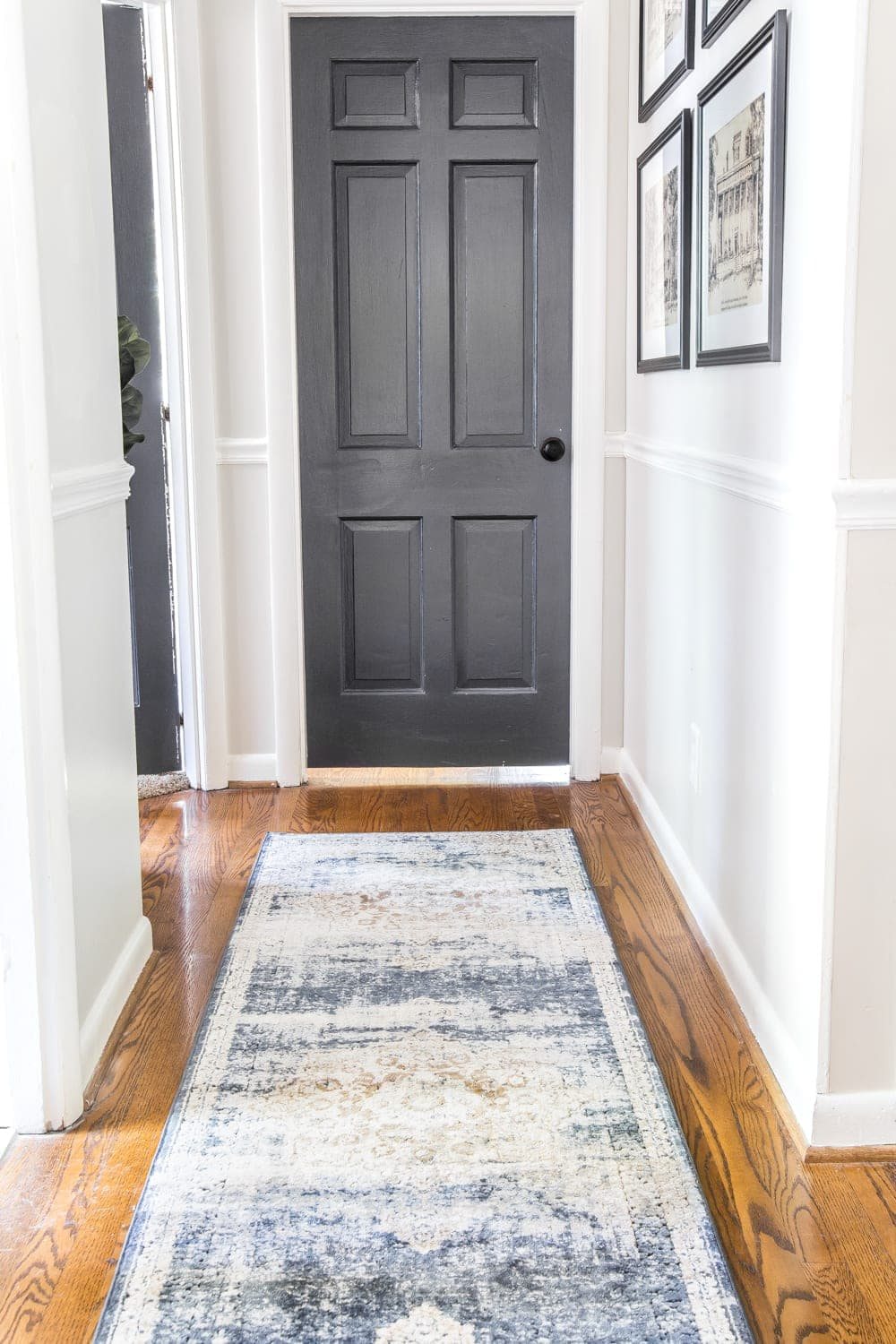 dark charcoal doors and hallway runner