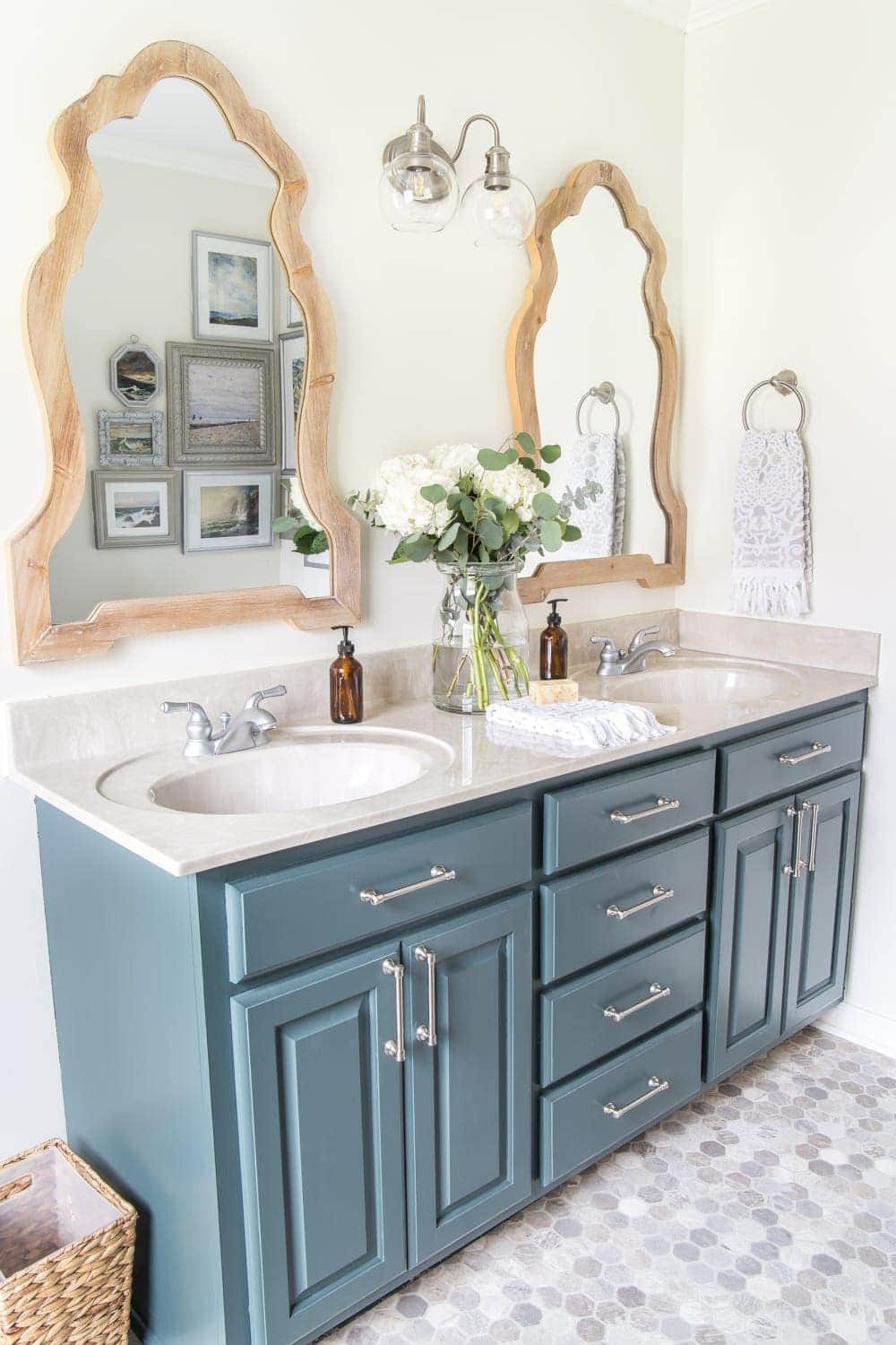 Budget Master Bathroom Refresh Reveal | Vinyl hexagon tile floor, wooden arch mirrors, and DIY painted vanity