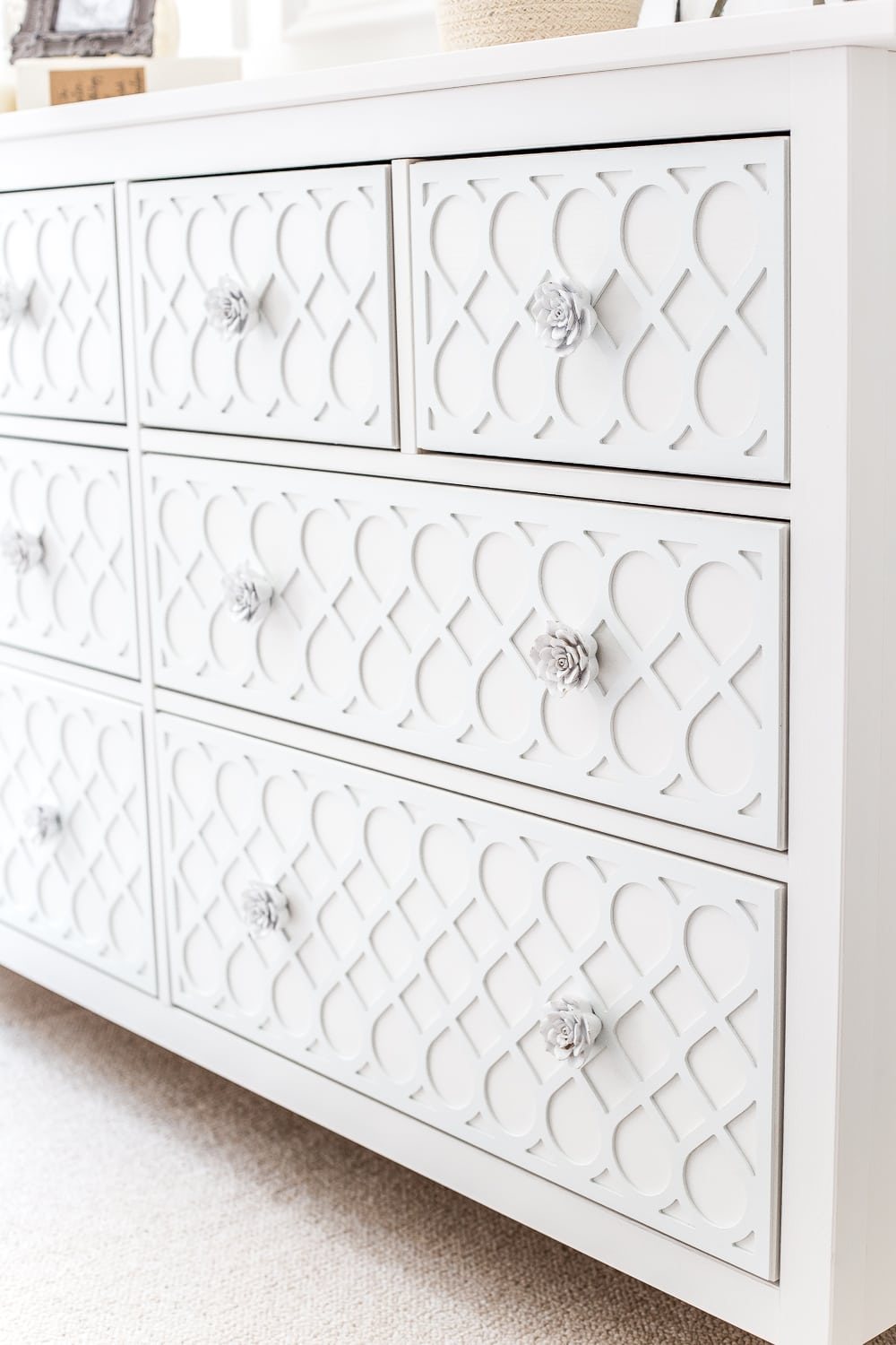 How to get a high-end carved detail look for less on a plain IKEA Hemnes dresser using appliques. #IKEAhack #dresser #furnituremakeover