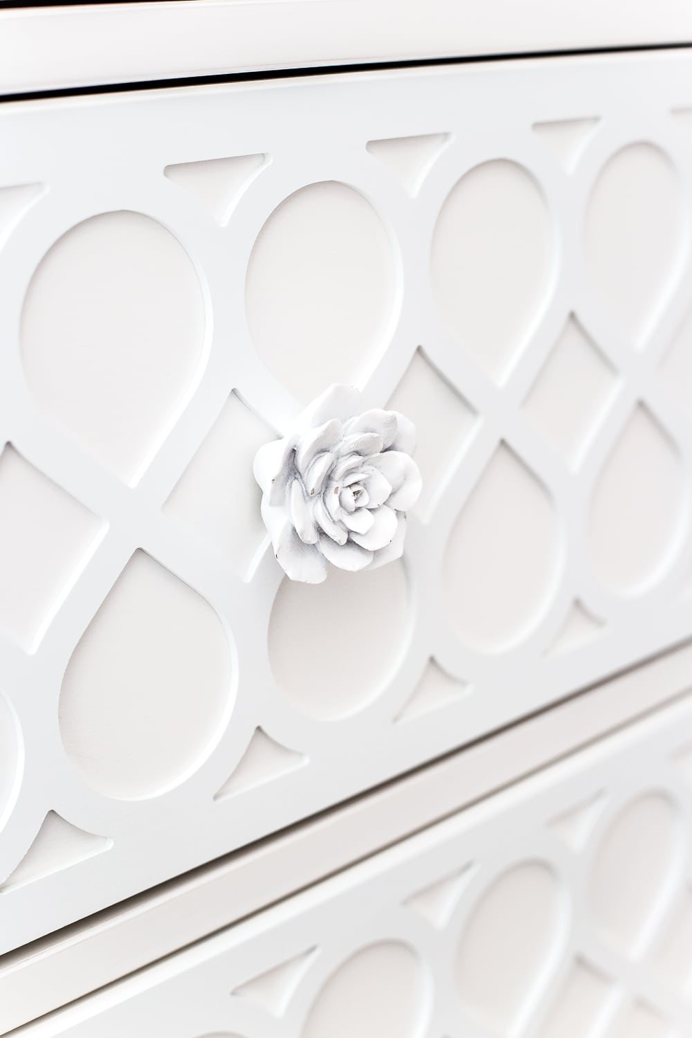 white cactus flower knobs and applique on a plain IKEA dresser