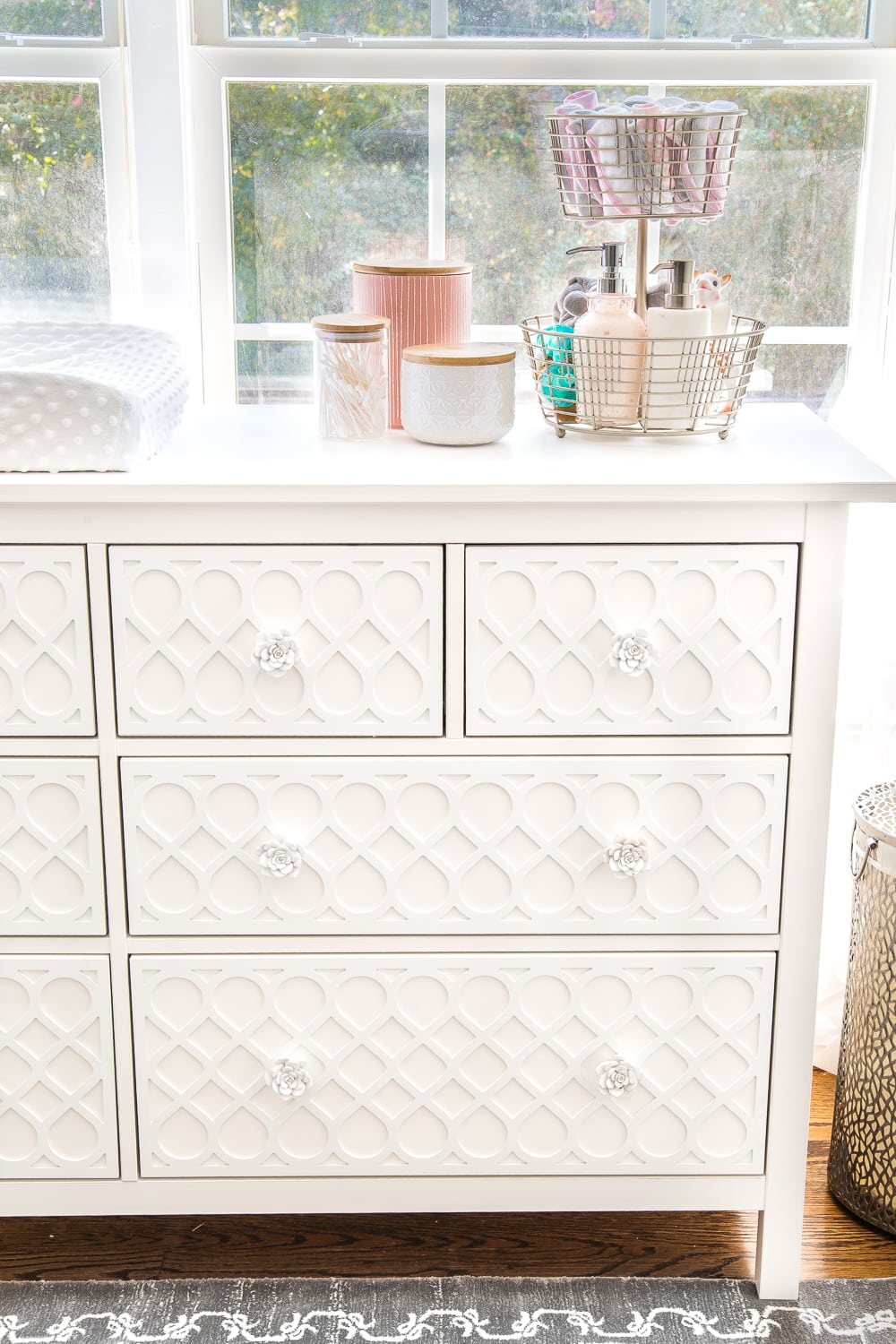 an organized dresser in a nursery