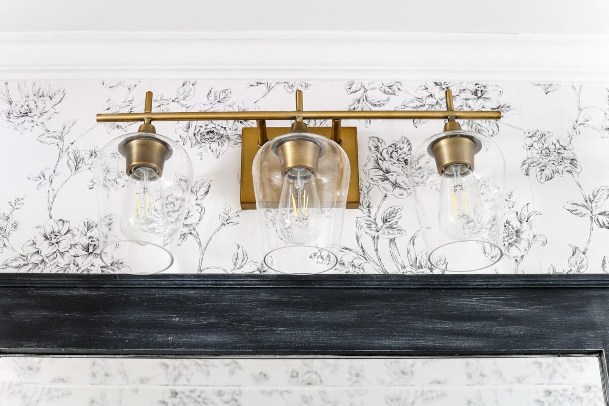 Aqua Meets Urban Powder Room Reveal | unigumushane.com - A dated powder room gets a modern meets traditional, urban meets farmhouse makeover with aquas, black and white, and antique brass.