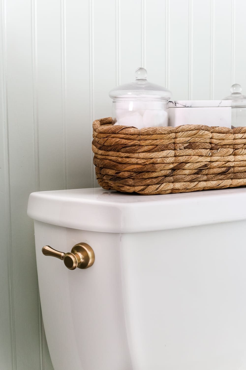 Aqua Meets Urban Powder Room Reveal | unigumushane.com - A dated powder room gets a modern meets traditional, urban meets farmhouse makeover with aquas, black and white, and antique brass.