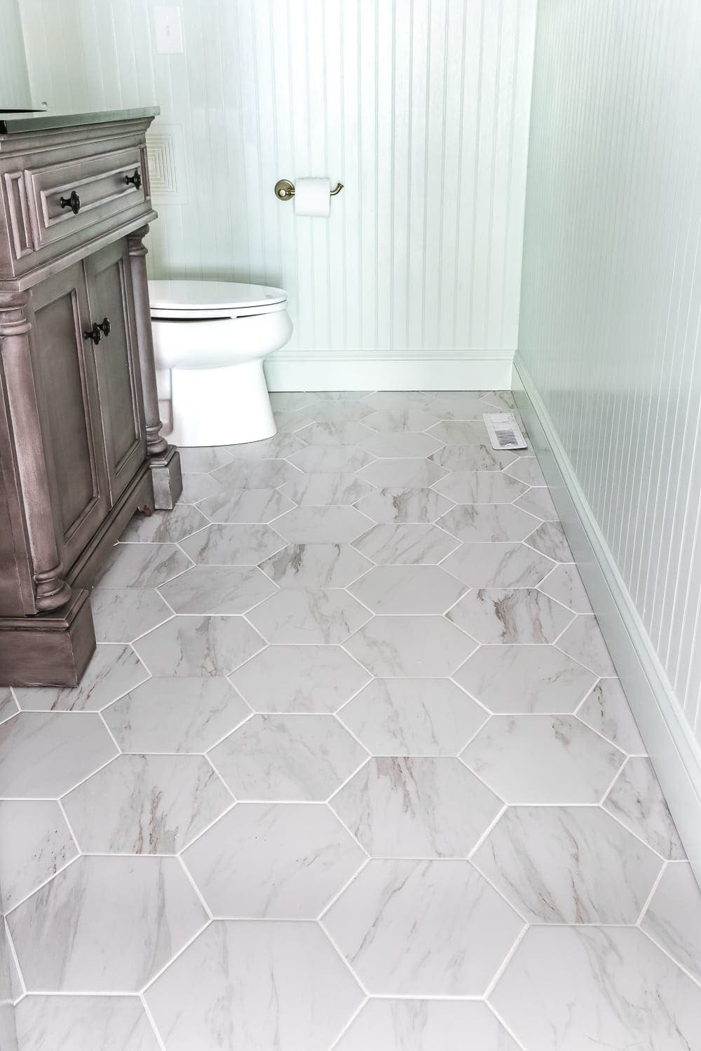 Aqua Meets Urban Powder Room Reveal | unigumushane.com - A dated powder room gets a modern meets traditional, urban meets farmhouse makeover with aquas, black and white, and antique brass.